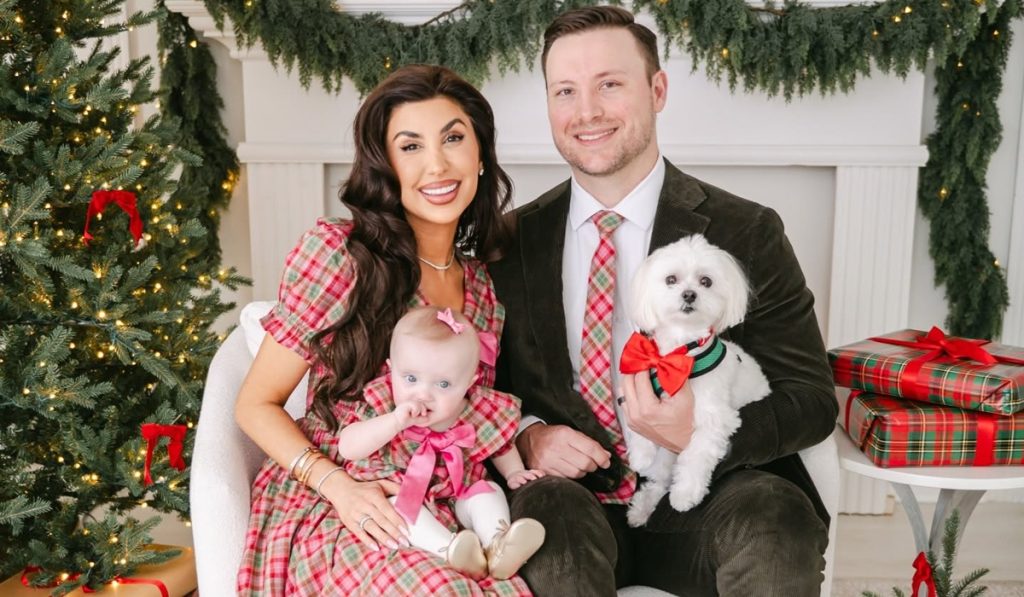 Courtney Khondabi with her husband, their daughter, and family dog.