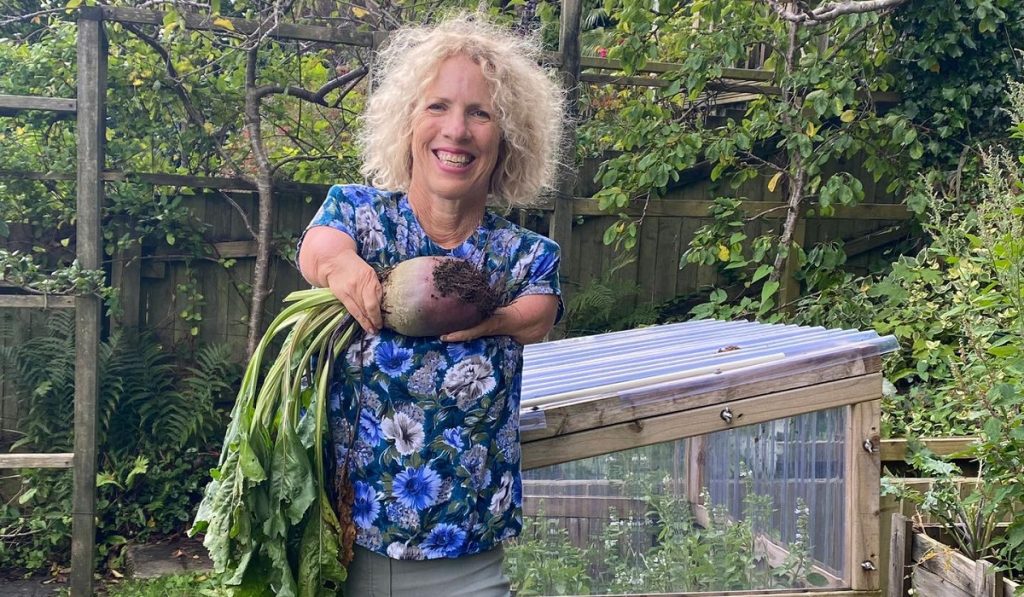 Sue Kent, who was born with an upper limb disability, gardens using both her hands and feet.